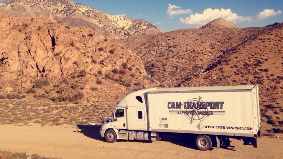 C&M Transport truck transporting goods for client