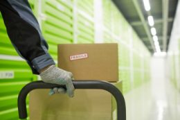 Warehouse worker taking extra care with fragile freight